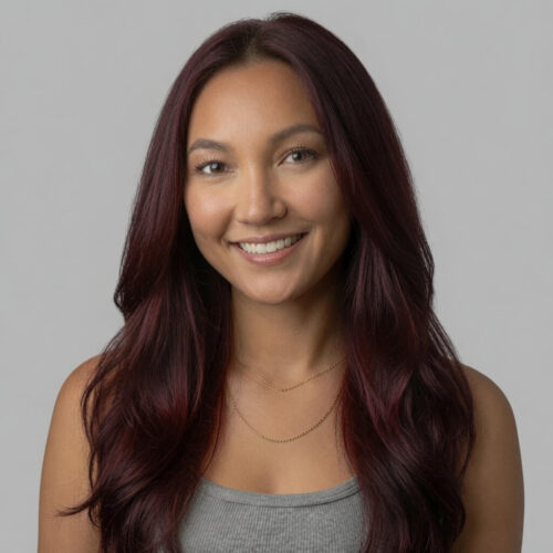 Wine red henna hair dye over dark straight hair.