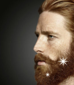 man with auburn beard and sparkles