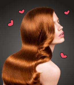woman with auburn hair and hearts