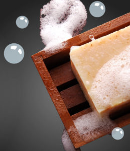 sudsy soap bar with soap dish and bubbles