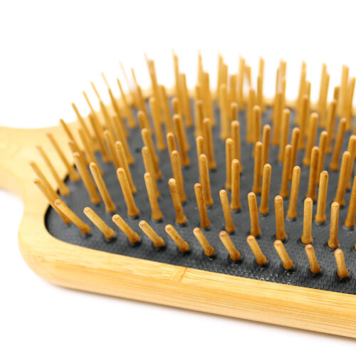 Henna color lab bamboo wood pin paddle brush. Zoomed image to show the beech wood bristles and soft padding.