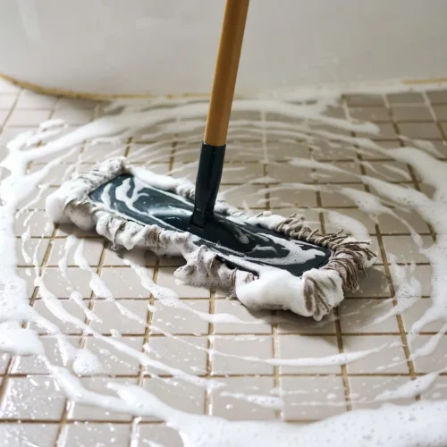 Image of mop cleaning floor with suds.